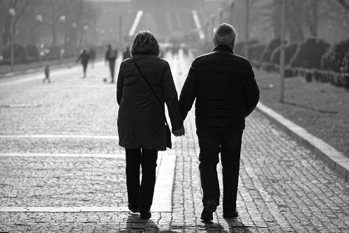 an elderly couple walking together